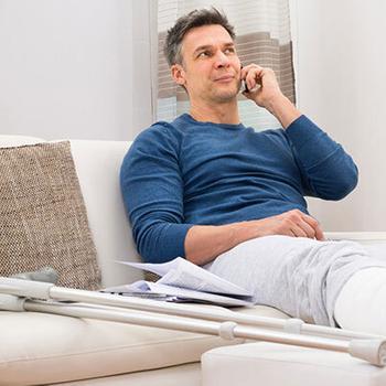 man with broken leg