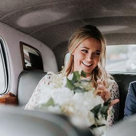 Bride and groom in car