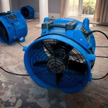 Fans drying out flood damage to a home