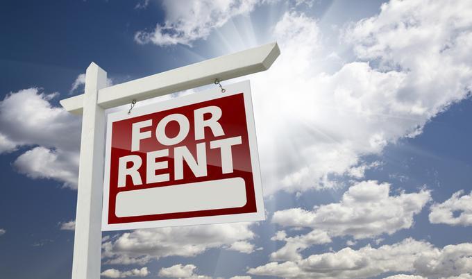 For Rent Sign with a view of the sky full of clouds.