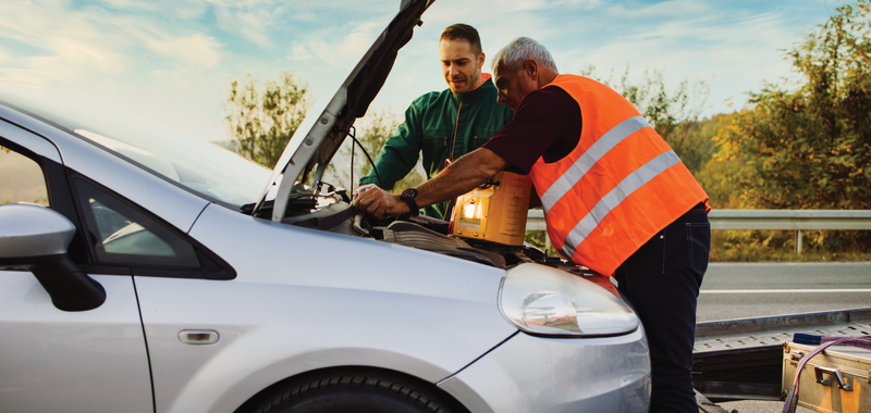 man providing roadside assistance to a customer 