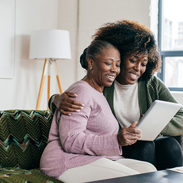 Caregiver helping with online communication