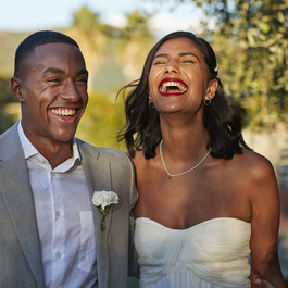 Wedding day couple laughing together