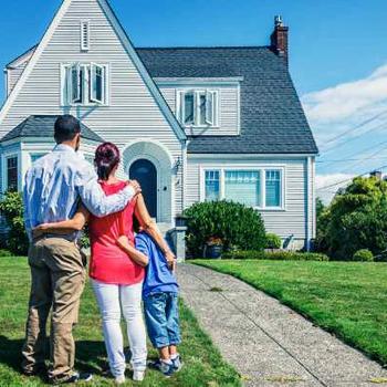 family looking at house