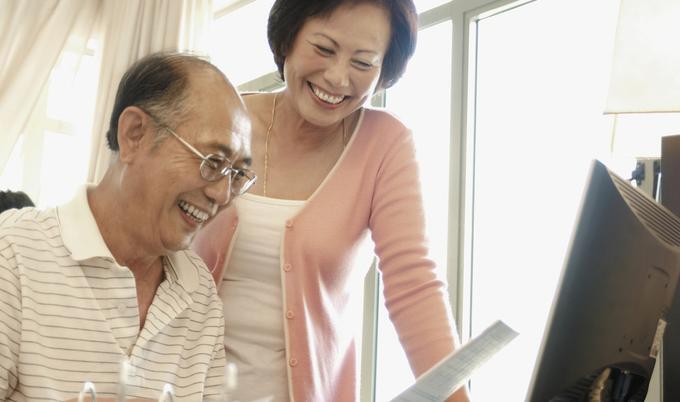 Husband and wife smiling.
