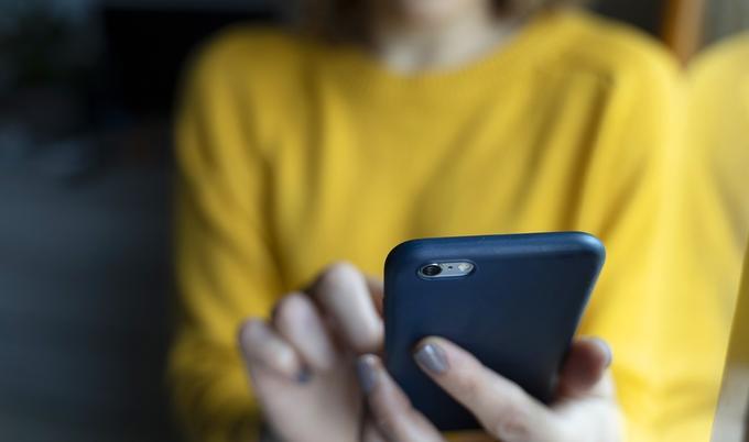 Woman browsing on cellphone.