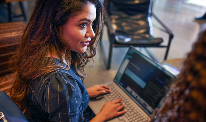 a woman using a laptop computer