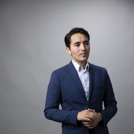 young hispanic man business casual portrait