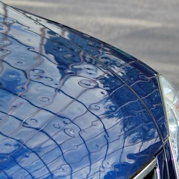 blue-car-with-hail-damage_GettyImages-494933117.jpg
