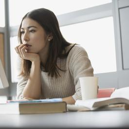 Young woman sitting in front of computer.