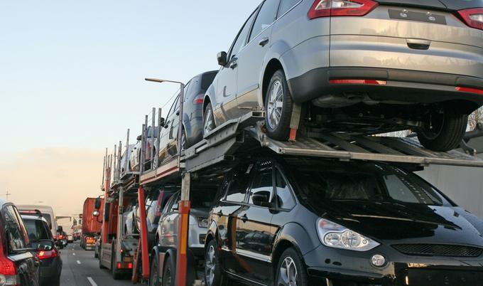 Back of a car carrier truck in traffic.
