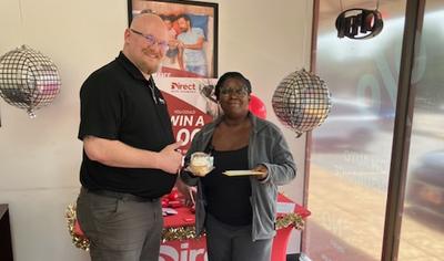 Agent standing with Circle K Gas Giveaway Winner