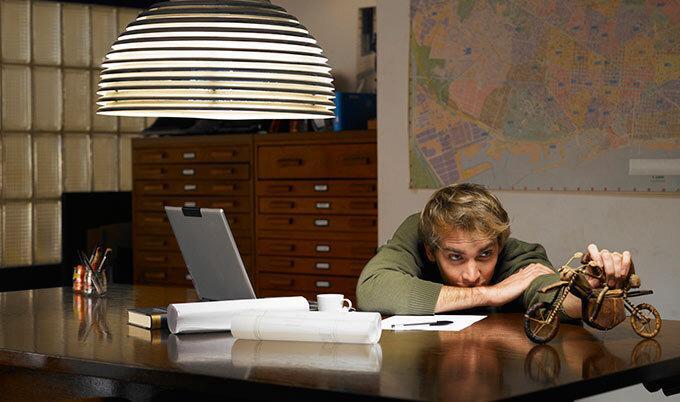 man with toy motorcycle