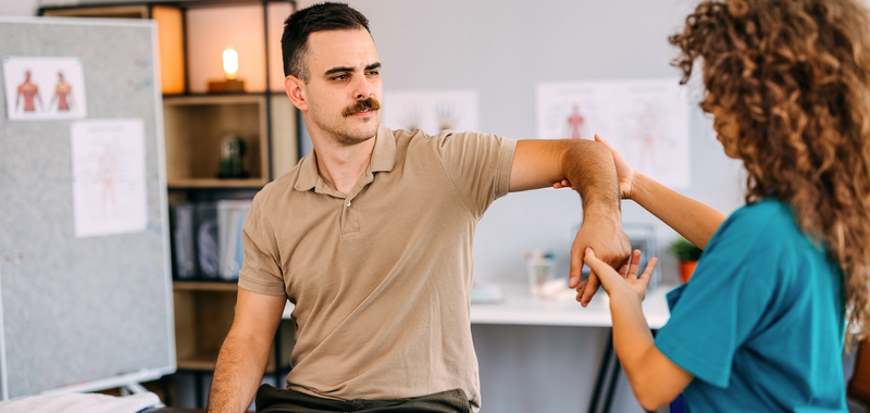 Physical therapy patient with doctor