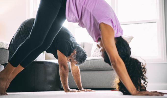 Man and woman doing yoga