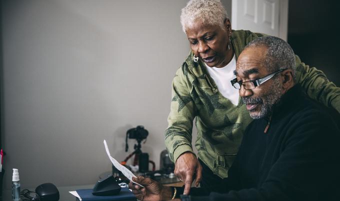Man and woman looking at papers