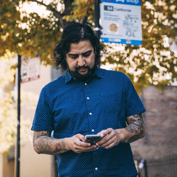guy walking with device.