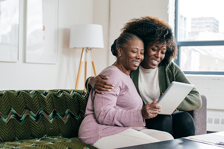 Caregiver helping with online communication