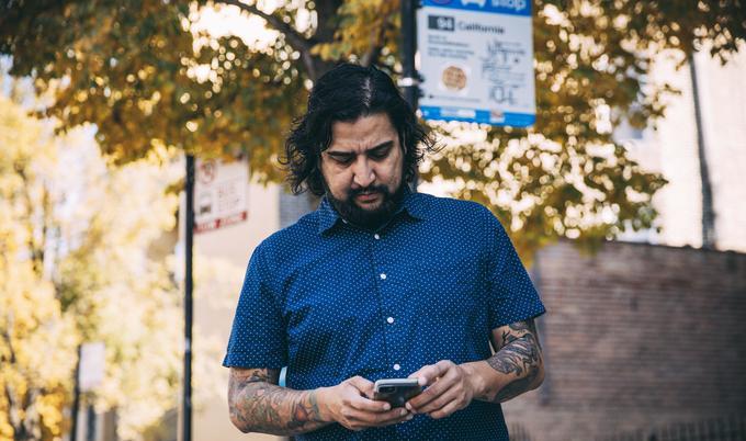 guy walking with device