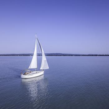 white-sailboat-on-calm-water_GettyImages.jpg