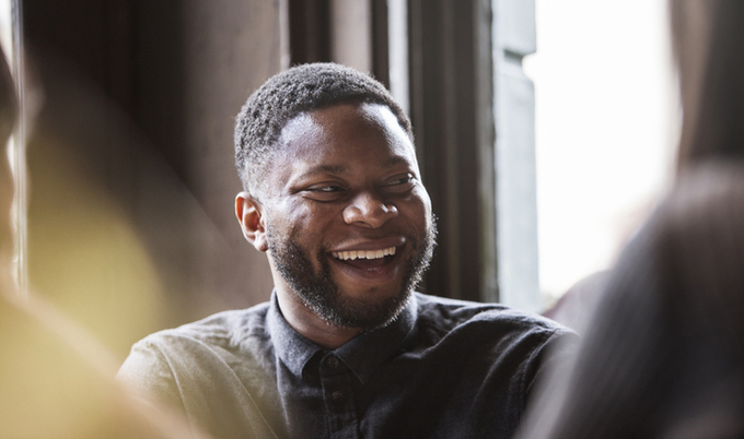 Man having a good time and laughing with his friends.