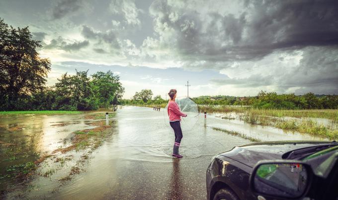 Woman on flooded road