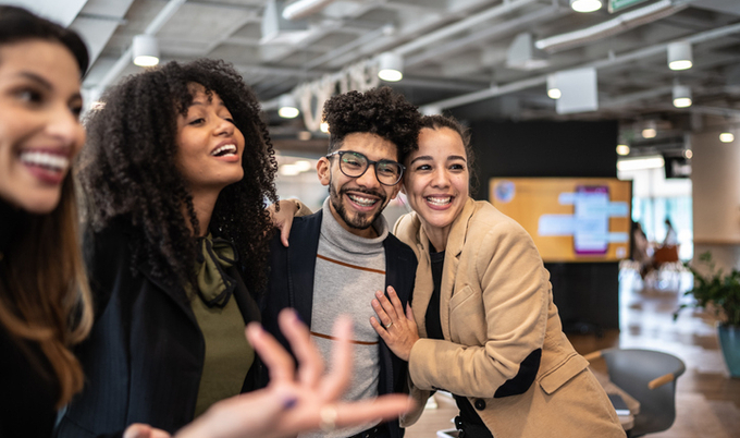 Co-workers enjoying time together in the office.